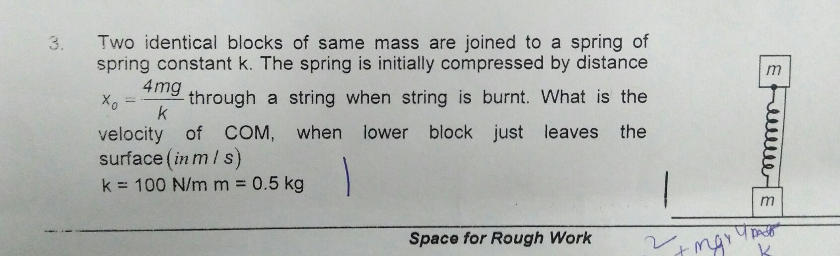 Question image for What is the velocity of Com when lower block just